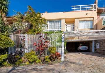 Casa com 3 quartos à venda na rua fonseca guimarães, 125, medianeira, porto alegre por r$ 750.000