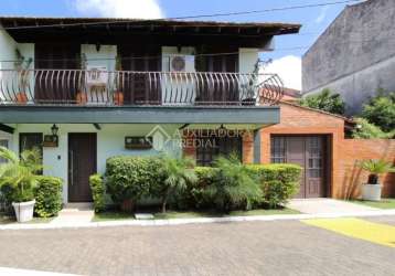 Casa em condomínio fechado com 3 quartos à venda na avenida juca batista, 1490, cavalhada, porto alegre, 196 m2 por r$ 480.000