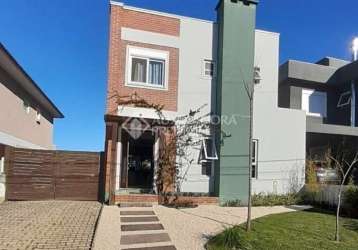 Casa em condomínio fechado com 3 quartos à venda na avenida senador salgado filho, 8500, jardim krahe, viamão, 220 m2 por r$ 1.170.000