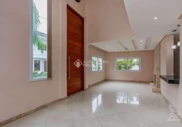 Casa em condomínio fechado com 3 quartos à venda na avenida ecoville, 356, sarandi, porto alegre, 188 m2 por r$ 950.000