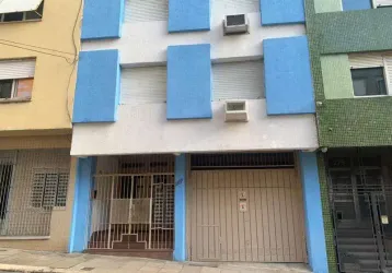 Apartamento jk no centro, com cozinha integrada com a área de serviço.