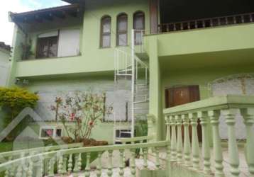 Casa em condomínio fechado com 4 quartos à venda na rua tietê, 375, igara, canoas por r$ 1.500.000