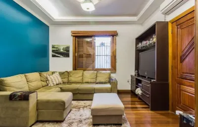 Casa com 5 quartos à venda na rua guilherme schell, 161, santo antônio, porto alegre por r$ 950.000