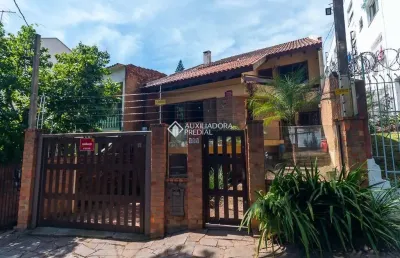 Casa com 3 quartos à venda na rua fagundes varela, 158, santo antônio, porto alegre, 400 m2 por r$ 1.100.000