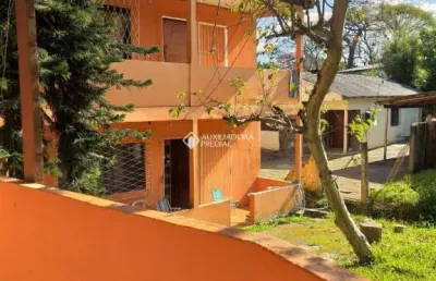 Casa com 4 quartos à venda na avenida vicente monteggia, 283, cavalhada, porto alegre, 200 m2 por r$ 640.000