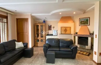 Casa com 3 quartos à venda na rua alcebíades antônio dos santos, 107, nonoai, porto alegre, 423 m2 por r$ 990.000