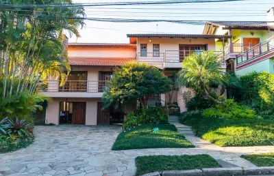 Casa em condomínio fechado com 5 quartos à venda na avenida firmino octávio bimbi, 255, cavalhada, porto alegre, 420 m2 por r$ 2.480.000