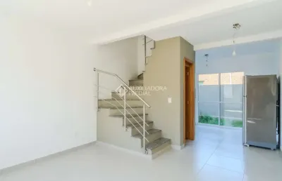 Casa em condomínio fechado com 2 quartos à venda na rua miguel ascoleze, 125, vila nova, porto alegre, 60 m2 por r$ 319.000