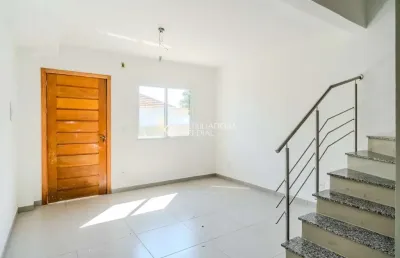 Casa em condomínio fechado com 2 quartos à venda na rua miguel ascoleze, 125, vila nova, porto alegre, 60 m2 por r$ 319.000