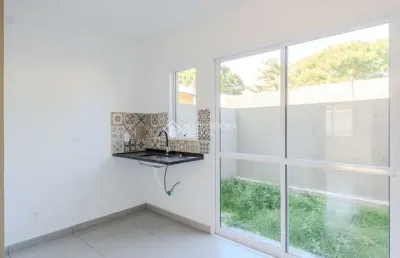 Casa em condomínio fechado com 2 quartos à venda na rua miguel ascoleze, 125, vila nova, porto alegre, 60 m2 por r$ 319.000