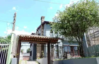 Casa em condomínio fechado com 5 quartos à venda na rua carajá, 213, vila assunção, porto alegre, 525 m2 por r$ 1.700.000