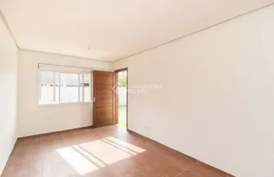 Casa em condomínio fechado com 2 quartos para alugar na rua santa mônica, 404, ponta grossa, porto alegre, 60 m2 por r$ 1.200