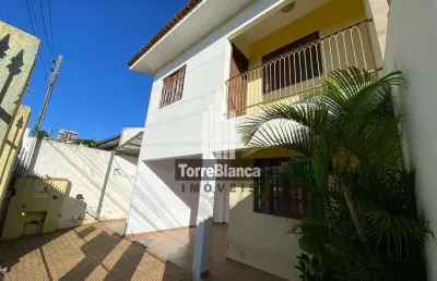 Oportunidade única: sobrado de 3 quartos próximo ao centro!
