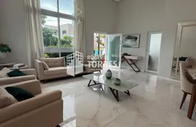 Casa térrea a venda de 6 suítes, piscina e área gourmet com churrasqueira e 4 garagens em alphaville litoral norte 2