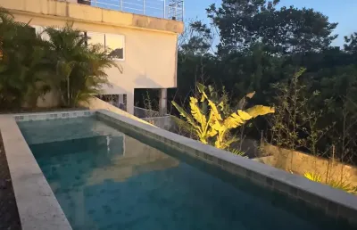 Casa em condomínio fechado com 4 quartos para alugar na Rua Caraíva, Abrantes, Camaçari