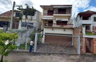 Casa com 6 quartos à venda na Rua Tomaz Edison, 416, Santo Antônio, Porto Alegre