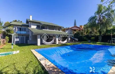 Casa em condomínio fechado com 3 quartos à venda na avenida firmino octávio bimbi, 255, cavalhada, porto alegre, 400 m2 por r$ 1.999.000
