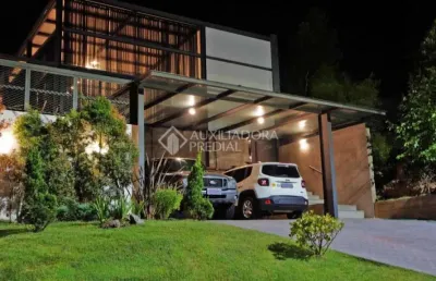 Casa em condomínio fechado com 3 quartos à venda na avenida senador salgado filho, 8500, jardim krahe, viamão, 357 m2 por r$ 1.200.000