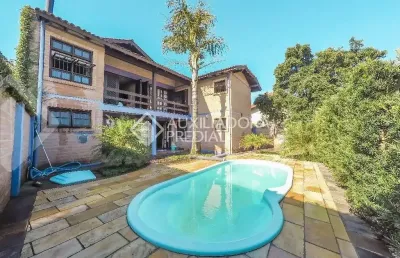 Casa em condomínio fechado com 5 quartos à venda na rua américa, 581, morro do espelho, são leopoldo, 427 m2 por r$ 1.300.000