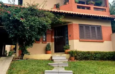 Casa com 3 quartos à venda na avenida elmira pereira silveira, 1033, jardim algarve, alvorada, 230 m2 por r$ 890.000
