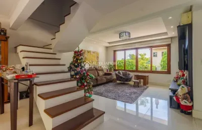 Casa em condomínio fechado com 3 quartos à venda na estrada joão de oliveira remião, 1761, agronomia, porto alegre, 241 m2 por r$ 849.000