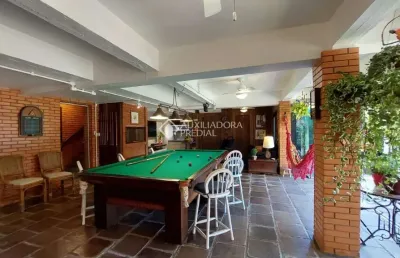 Casa em condomínio fechado com 3 quartos à venda na rua inhanduí, 252, cristal, porto alegre, 309 m2 por r$ 1.600.000