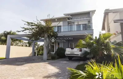 Casa em condomínio fechado com 4 quartos à venda na avenida senador salgado filho, 8500, querência, viamão, 273 m2 por r$ 1.260.000