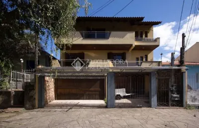 Casa com 4 quartos à venda na rua pinto da rocha, 383, partenon, porto alegre, 250 m2 por r$ 900.000