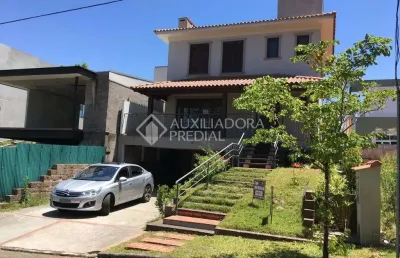 Casa em condomínio fechado com 3 quartos à venda na avenida senador salgado filho, 8501, jardim krahe, viamão, 234 m2 por r$ 1.850.000