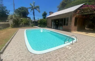 Casa com 3 quartos à venda na maura­cio lessa, 295, flórida, guaíba, 300 m2 por r$ 970.000