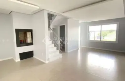 Casa em condomínio fechado com 3 quartos à venda na rua ravena, 66, estância velha, canoas, 125 m2 por r$ 689.990