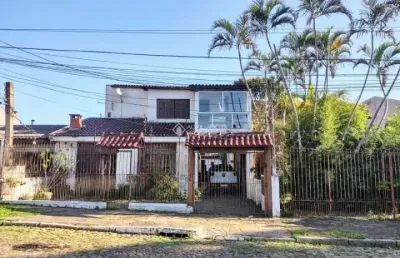 Casa com 6 quartos à venda na rua fábio de barros, 388, nonoai, porto alegre, 294 m2 por r$ 693.000