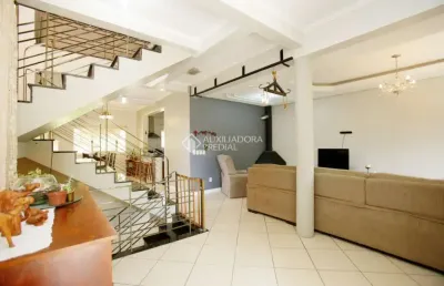 Casa com 5 quartos à venda na rua isidoro tressi, 507, jardim botânico, porto alegre, 379 m2 por r$ 1.550.000