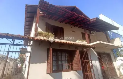 Casa com 3 quartos à venda na avenida doutor petrônio portella, 1415, parque santa fé, porto alegre, 267 m2 por r$ 850.000