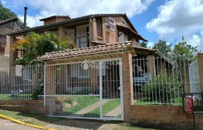 Casa em condomínio fechado com 4 quartos à venda na rua mogno, 24, cantegril, viamão, 190 m2 por r$ 550.000