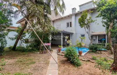 Casa em condomínio fechado com 3 quartos à venda na rua das bromélias, 247, estância velha, canoas, 135 m2 por r$ 850.000