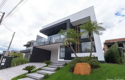 Casa em condomínio fechado com 3 quartos à venda na rua adolfo inácio de barcelos, 1490, centro, gravataí, 255 m2 por r$ 2.700.000
