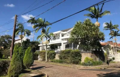 Casa em condomínio fechado com 5 quartos à venda na rua desembargador hugo candal, 230, três figueiras, porto alegre, 470 m2 por r$ 2.600.000