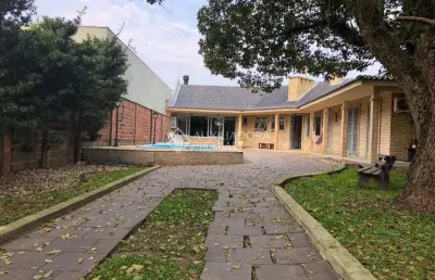 Casa em condomínio fechado com 5 quartos à venda na rua bagé, 623, niterói, canoas, 235 m2 por r$ 1.250.000