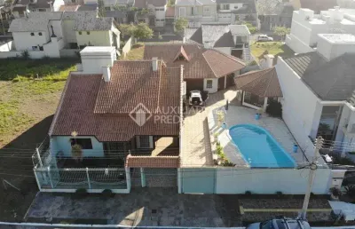 Casa em condomínio fechado com 4 quartos à venda na rua alpina, 38, estância velha, canoas, 420 m2 por r$ 1.998.000