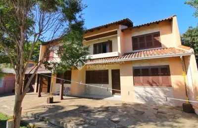Casa em condomínio fechado com 4 quartos à venda na rua ney brito, 140, nossa senhora das graças, canoas, 220 m2 por r$ 954.000