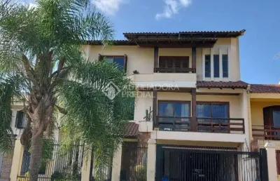 Casa em condomínio fechado com 4 quartos à venda na rua maestro salvador campanella, 116, jardim itu sabará, porto alegre, 410 m2 por r$ 1.400.000