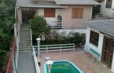 Casa com 3 quartos à venda na rua ângelo passuelo, 330, vila nova, porto alegre, 570 m2 por r$ 650.000