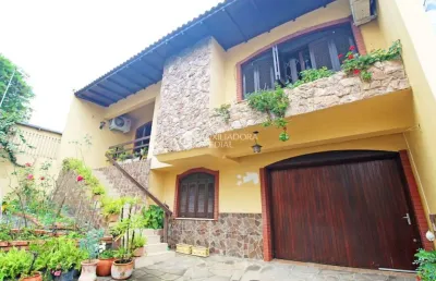 Casa com 3 quartos à venda na rua umbú, 137, passo da areia, porto alegre, 154 m2 por r$ 1.280.000
