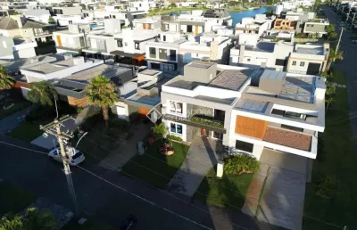 Casa em condomínio fechado com 4 quartos à venda na rua rio divisa, 22, centro, xangri-lá, 228 m2 por r$ 2.180.000