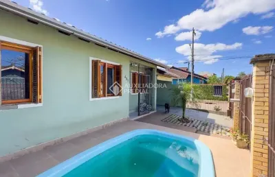 Casa com 3 quartos à venda na rua corujas, 437, jardim algarve, alvorada, 120 m2 por r$ 304.000