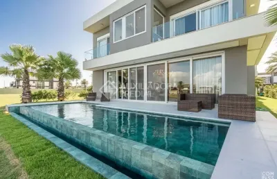 Casa em condomínio fechado com 5 quartos à venda na rua rio jacuí, 1331, centro, xangri-lá, 415 m2 por r$ 5.400.000