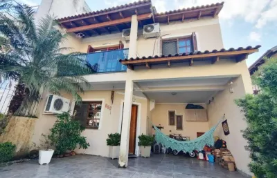 Casa em condomínio fechado com 3 quartos à venda na rua pau brasil, 329, hípica, porto alegre, 140 m2 por r$ 580.000