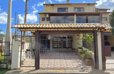 Casa com 4 quartos à venda na rua doutor egydio michaelsen, 58, cavalhada, porto alegre, 202 m2 por r$ 655.000