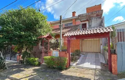 Casa com 3 quartos à venda na rua marcos wainstein, 30, vila nova, porto alegre, 200 m2 por r$ 460.000